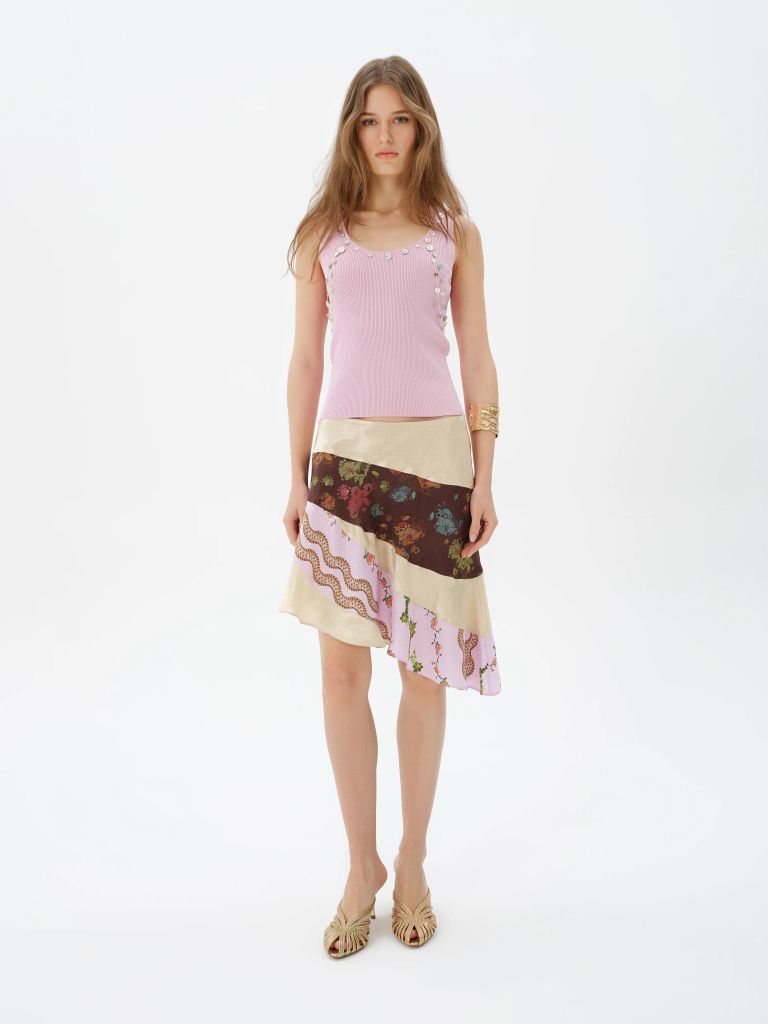 model in pink knit tank and patchwork midi skirt