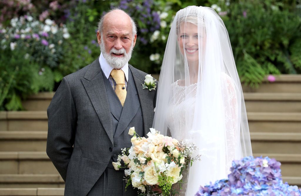 Britain's Lady Gabriella Windsor poses with her father, Britain's Prince Michael of Kent, before her wedding ceremony to Thomas Kingston 