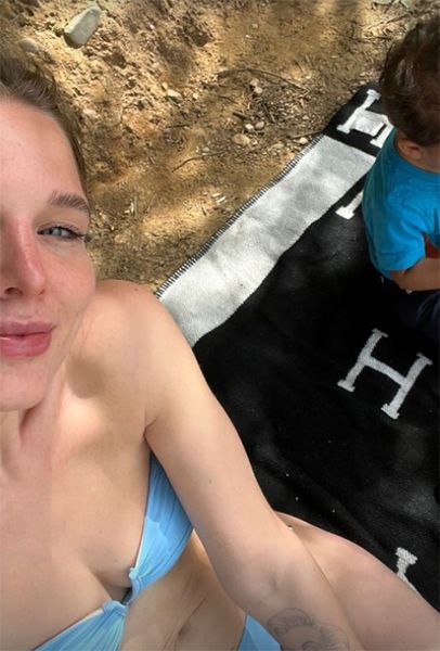 Helen Flanagan in bikini with baby son next to her