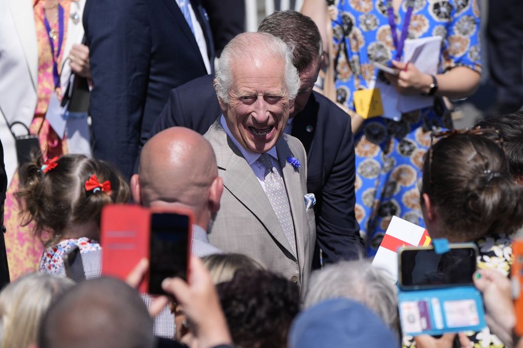 King Charles III and Queen Camilla during a walk about to meet members of the public in Saint Peter Port, Guernsey, d