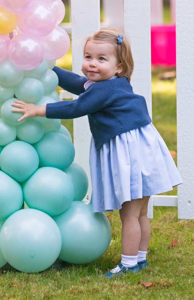 Princess Charlotte standing next to balloon arch in Canada, 2016