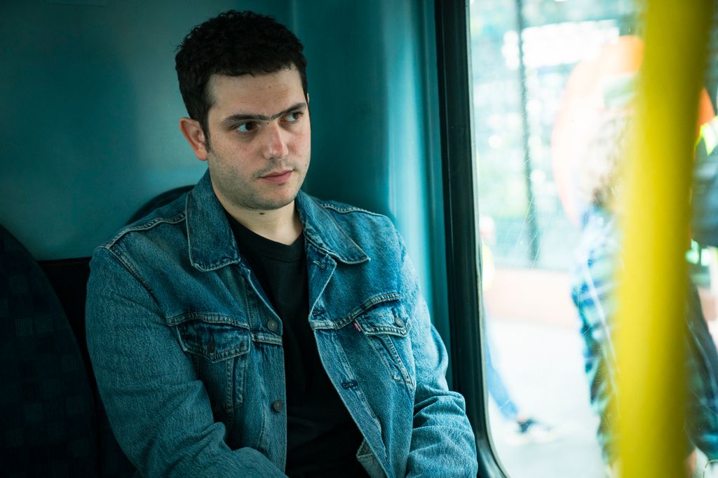 man sitting on bus