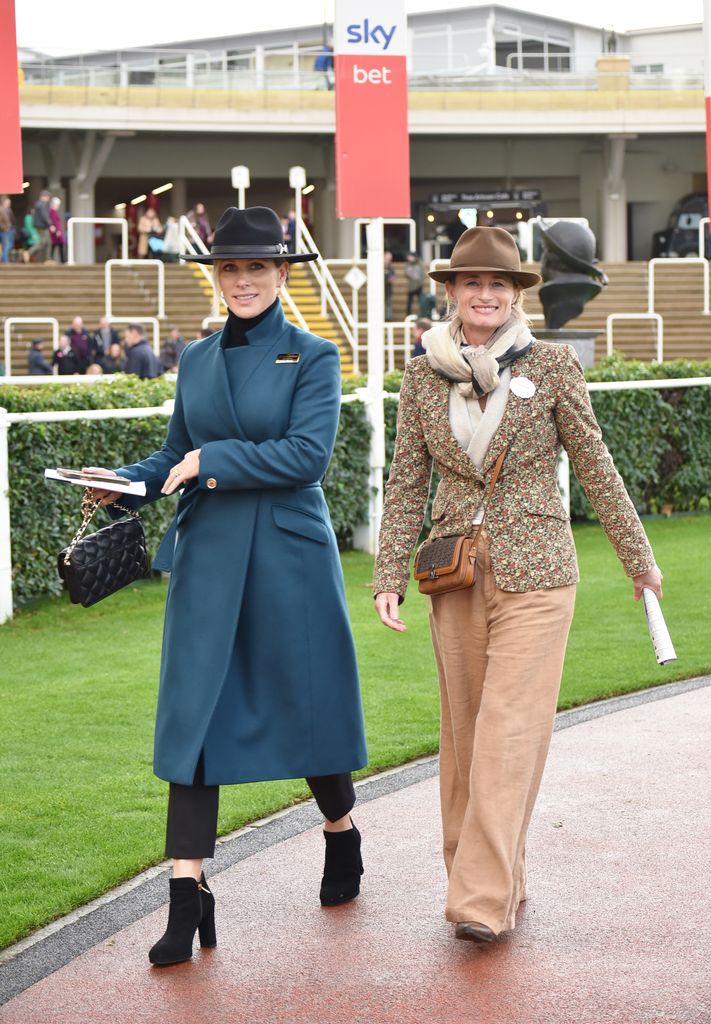 Zara Tindall in blue coat at races with Dolly Maude