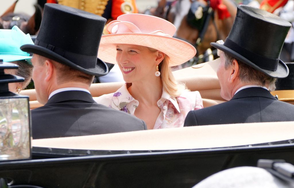 Lady Gabriella Kingston smiles in carriage