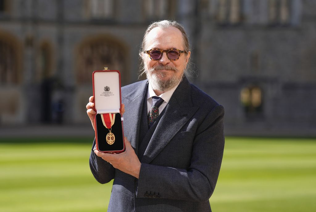 Gary Oldman holding his knighthood