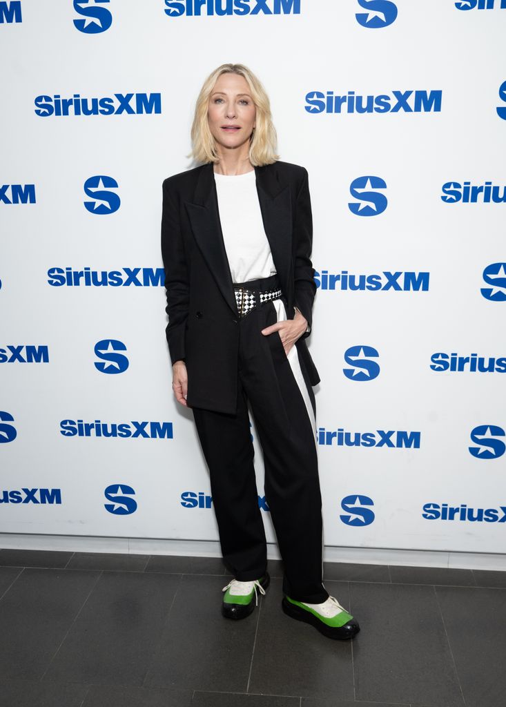 Cate Blanchett in black trousers and blazer