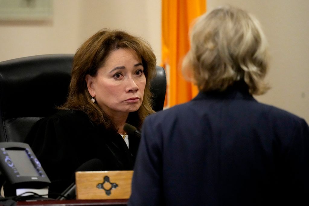Judge Mary Marlowe Sommer, left, listens to prosecutor Kari Morrissey speak during actor Alec Baldwin's hearing in Santa Fe County District Court, July 10, 2024, in Santa Fe, New Mexico