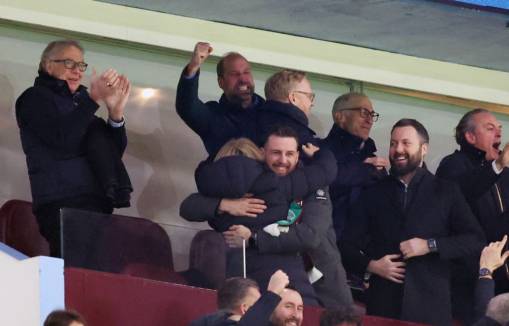 Prince William and a group of football fans cheering