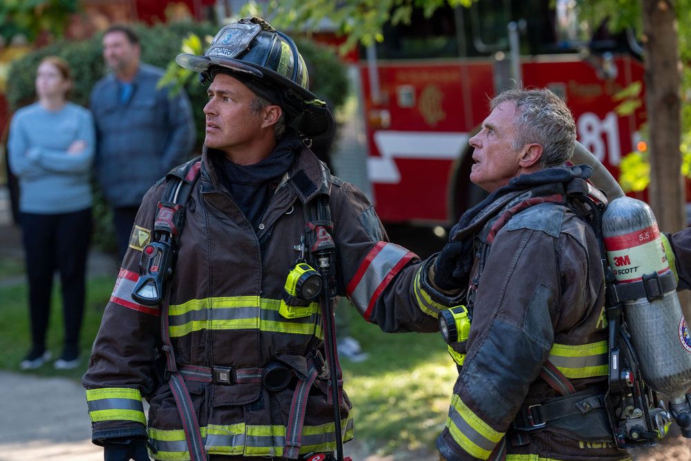 Taylor Kinney as Kelly Severide, David Eigenberg as Christopher Herrmann in Chicago Fire