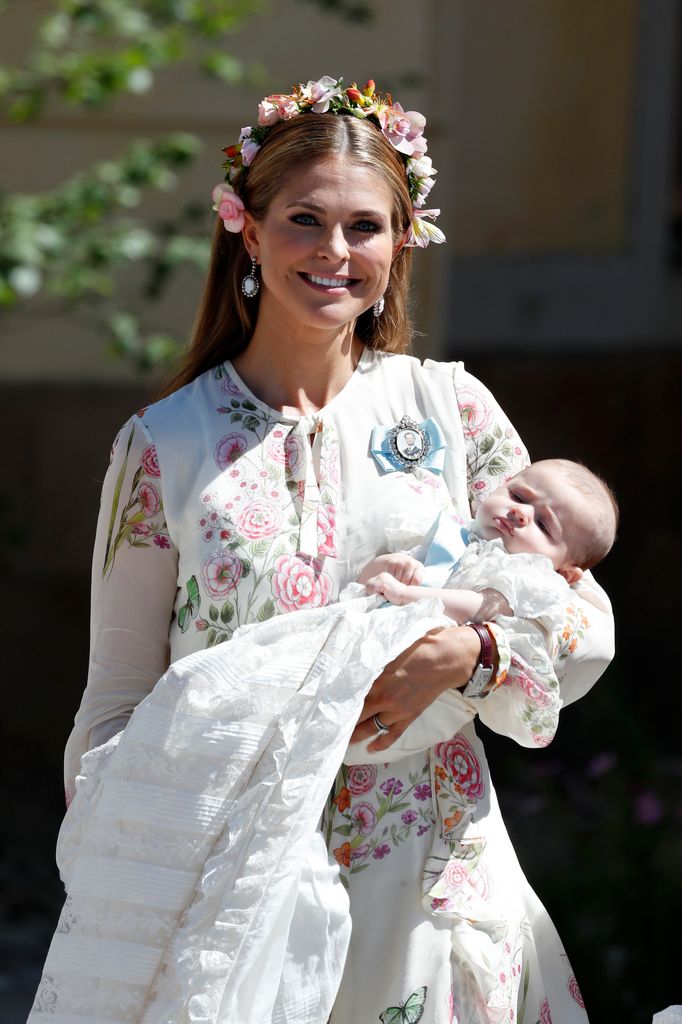 Princess Madeleine of Sweden holding  Princesse Adrienne of Sweden, leaves the christening of Princess Adrienne of Sweden at Drottningholm Palace Chapel on June 8, 2018 in Stockholm, Sweden.