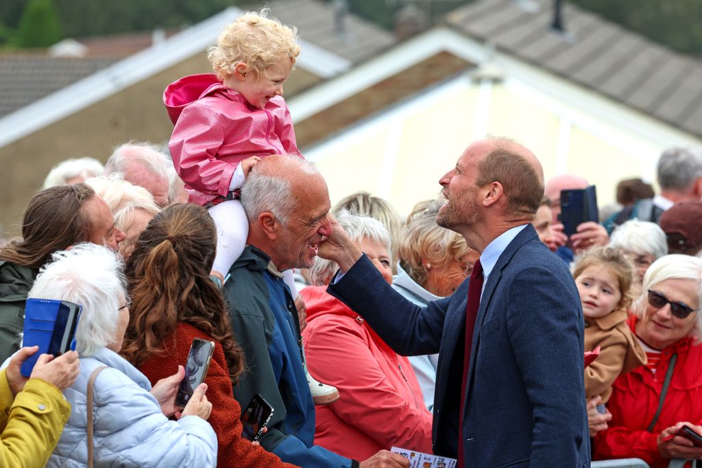 Prince William greets well-wishers while departing from a visit to Swiss Valley Community Primary School