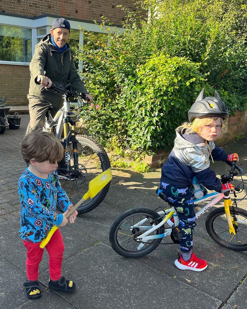 jonnie irwin riding a bike with sons 