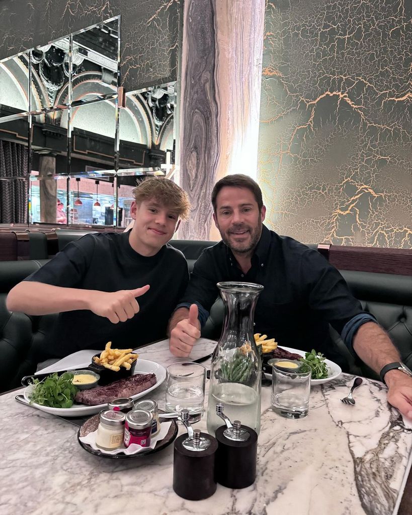 Jamie Redknapp and Beau holding thumbs up at dinner