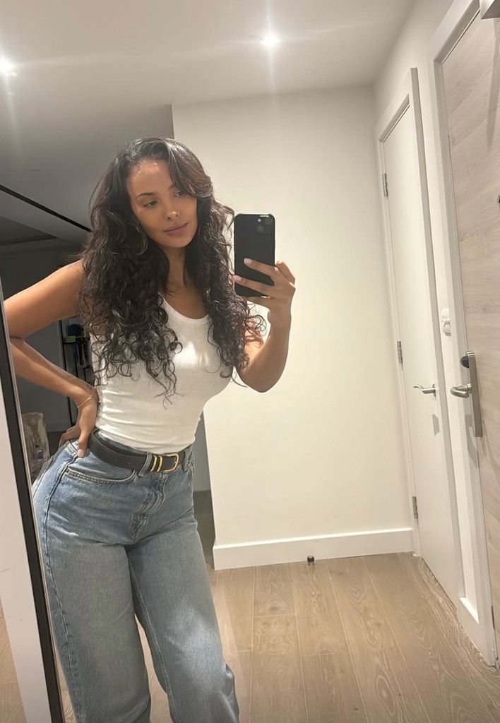 maya jama in blue jeans and white top