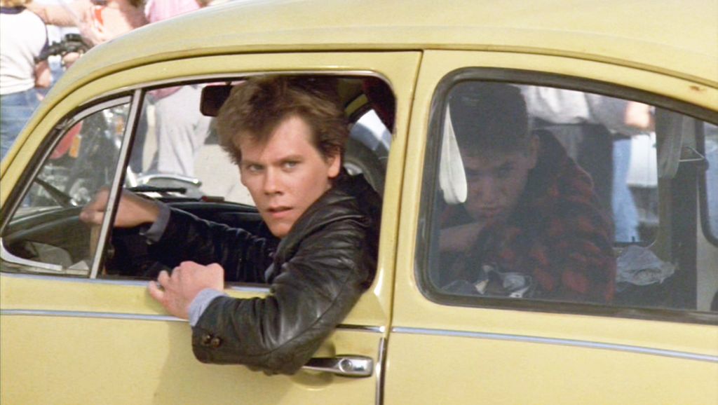 The movie "Footloose", directed by Herbert Ross and written by Dean Pitchford. Seen here, Kevin Bacon as Ren MacCormack in a 1972 Volkswagen 'Beetle'. Initial theatrical release February 17, 1984