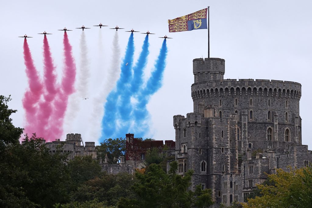 The Red Arrows aerobatic display team fly past the Round Tower at Windsor Castle, in Windsor, on September 17, 2025, during US President Donald Trump's second State Visit. US President Donald Trump arrived in Britain for an unprecedented second State Visit, with the UK government rolling out a royal red carpet welcome to win over the mercurial leader.
