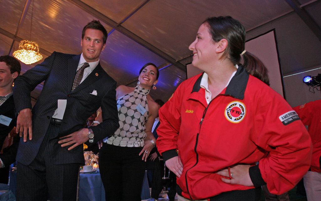 New England Patriot Tom Brady (L) and his sister Nancy (C) do a City Year morning work out routine with Jackie Levine (R) at the City Year's Young Leaders At Boston Common Gala