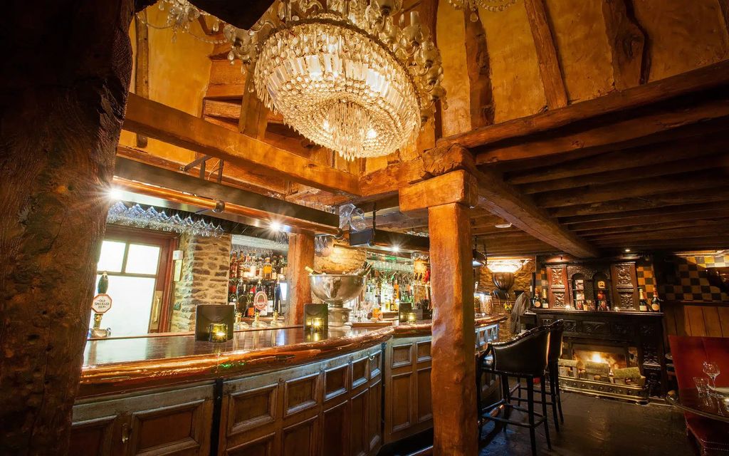 Wooden beamed pub with a chandalier