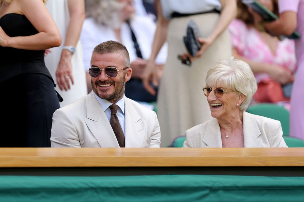 Sir David Beckham is seen in the Royal Box with his mother, Sandra Beckham