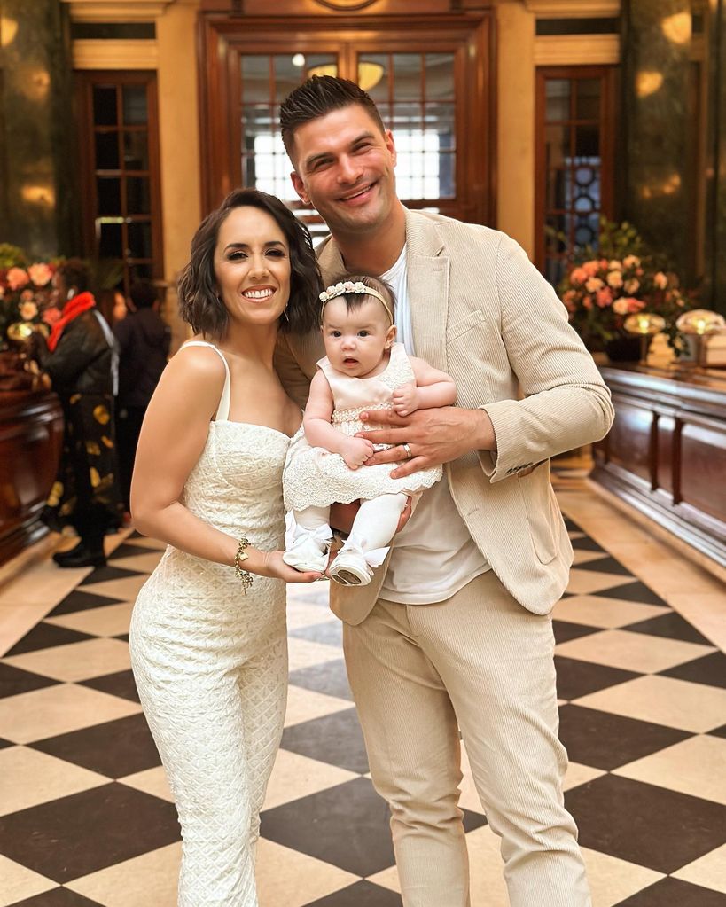 Janette and aljaz holding lyra