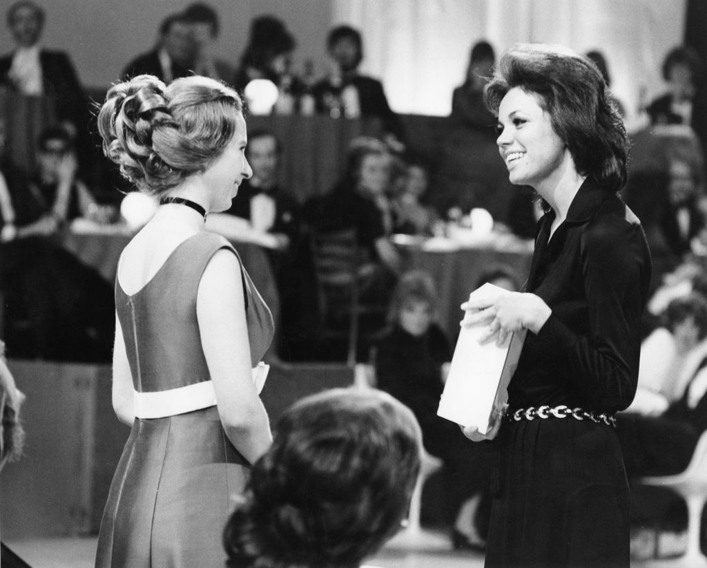 black and white photo of young anne giving award to Jo Ann Pflug