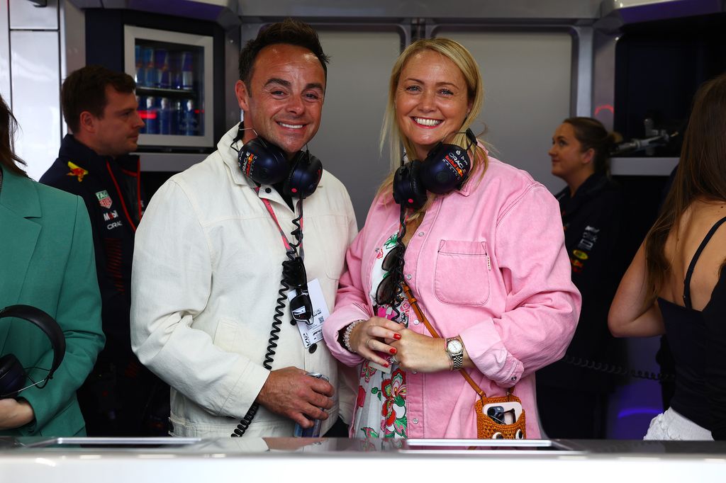 Ant McPartlin and Anne-Marie Corbett in F1 garage