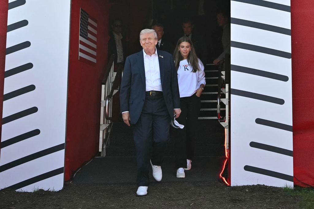 U.S. President Donald Trump, along with his granddaughter Kai Madison Trump, attends the 2025 Ryder Cup 