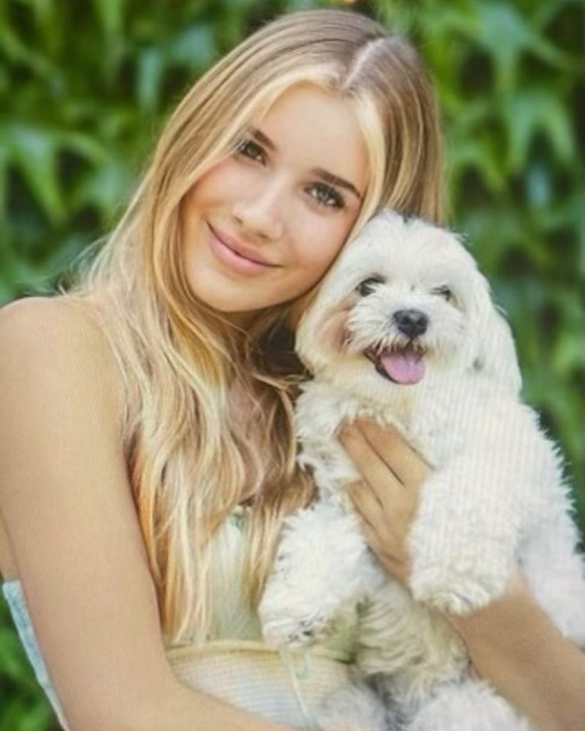 Phoebe holding dog