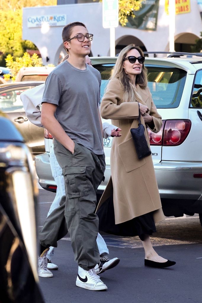 Angelina's son Knox towers over his mom