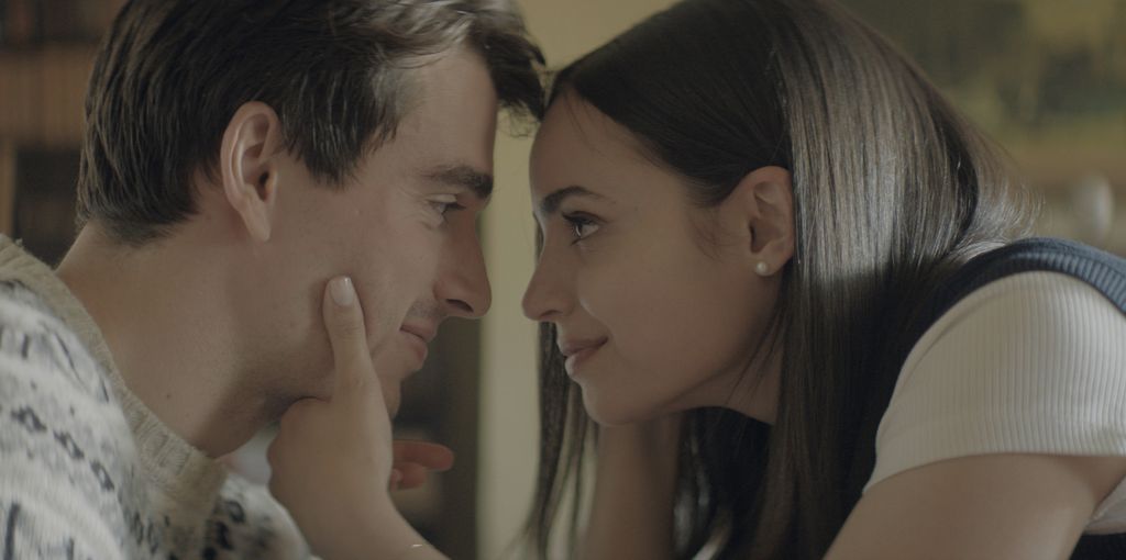 man and woman looking at each other, close-up