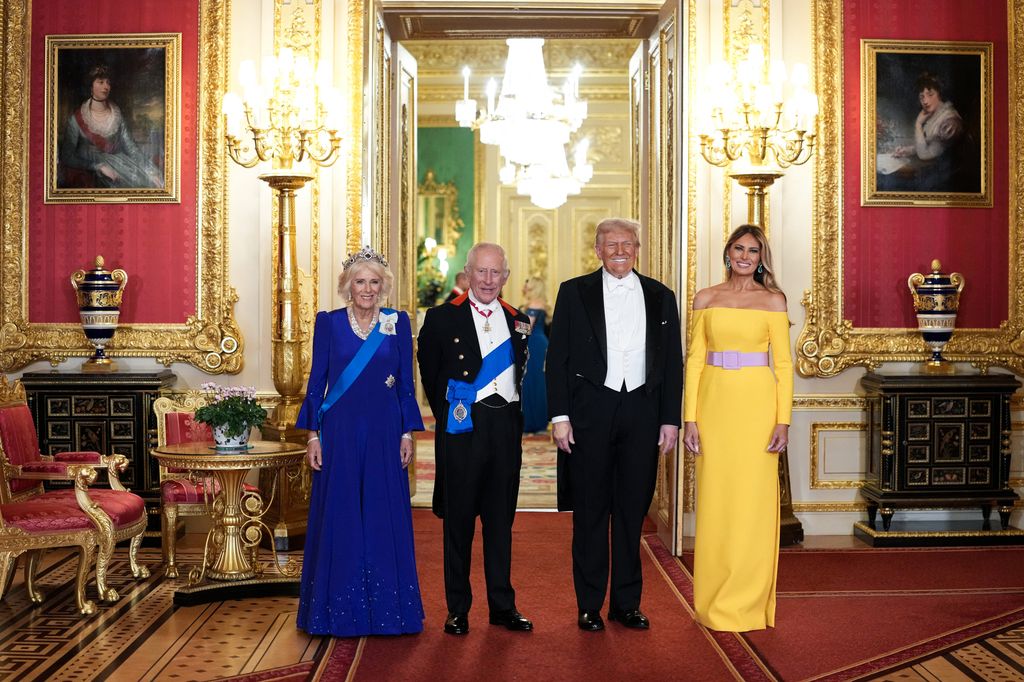 Britain's Queen Camilla, Britain's King Charles III, US President Donald Trump and US First Lady Melania Trump pose for a photo as they attend a State Banquet at Windsor Castle, in Windsor, on September 17, 2025, during the US President's second State Visit. US President Donald Trump arrived in Britain for an unprecedented second State Visit, with the UK government rolling out a royal red carpet welcome to win over the mercurial leader.