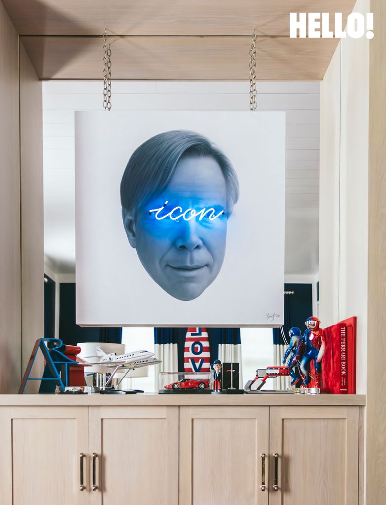 The neon icon portrait is by Shyglo in Tommy's office in the Palm Beach mansion