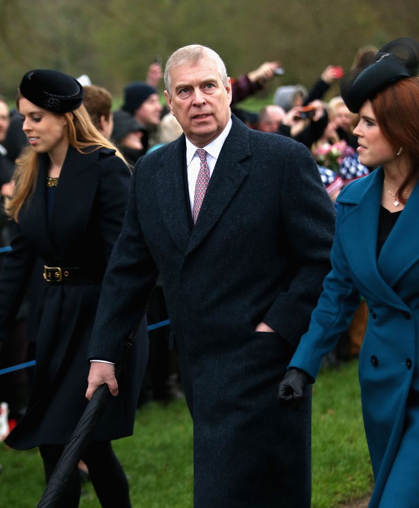 Prince Andrew walking with Princess Beatrice and Princess Eugenie
