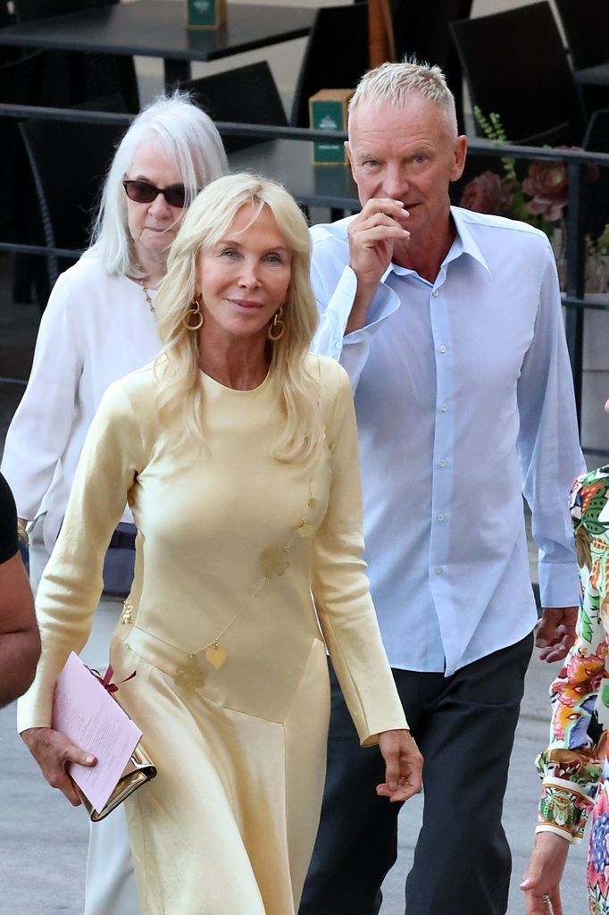 Trudie in  buttermilk yellow dress beside sting