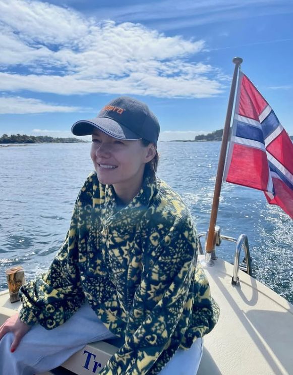 Kara Tointon on a boat that displays the Norwegian flag