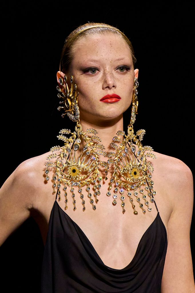 Schiaparelli AW22 model wearing eyeball earrings