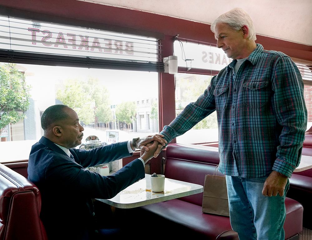 Rocky Carroll and Mark Harmon in a diner filming NCIS