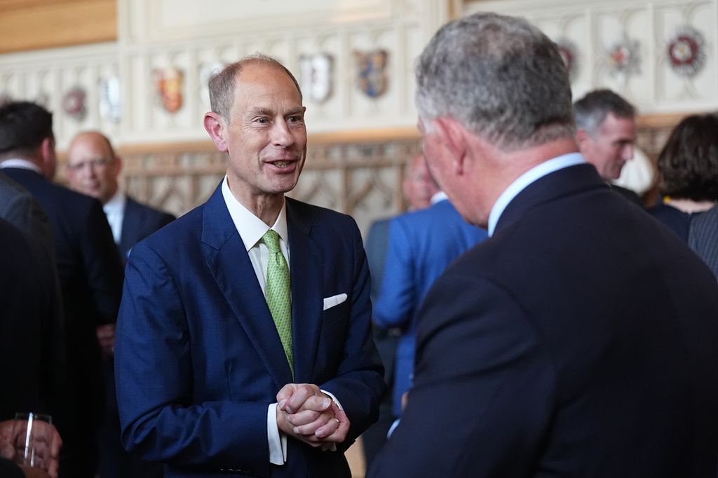 Britain's Prince Edward, Duke of Edinburgh mees with guests during a reception for recipients of The King's Award for Enterprise