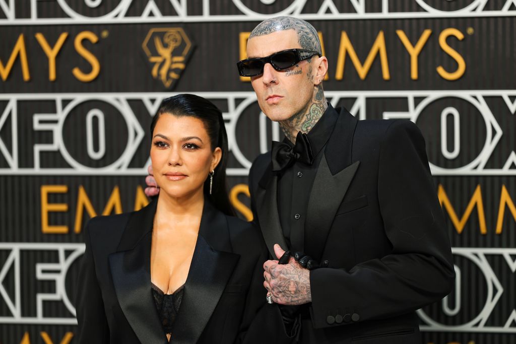 LOS ANGELES, CALIFORNIA - JANUARY 15: (L-R) Kourtney Kardashian and Travis Barker attend the 75th Primetime Emmy Awards at Peacock Theater on January 15, 2024 in Los Angeles, California. (Photo by Neilson Barnard/Getty Images)