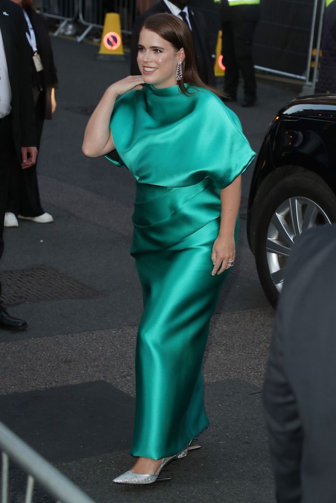 Princess Eugenie walking in emerald green dress