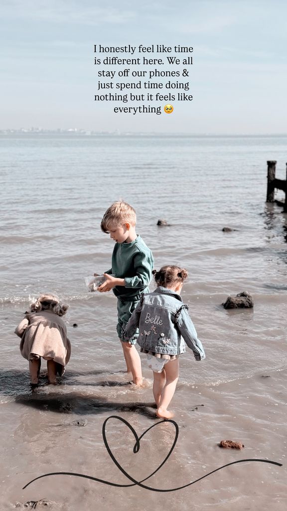 three children playing on the beach
