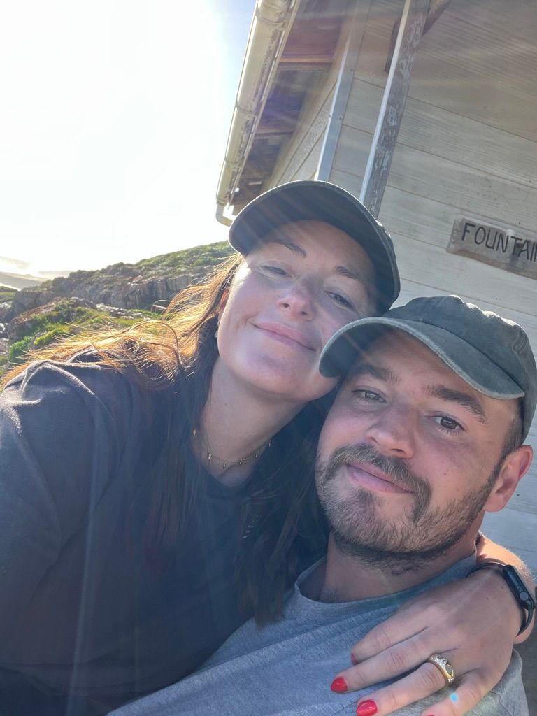 selfie of a man and woman smiling outdoors
