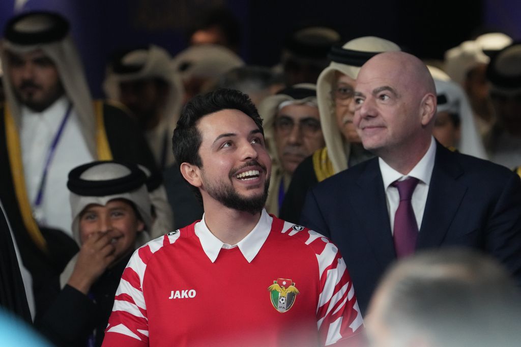 Crown Prince Hussein in a red football shirt