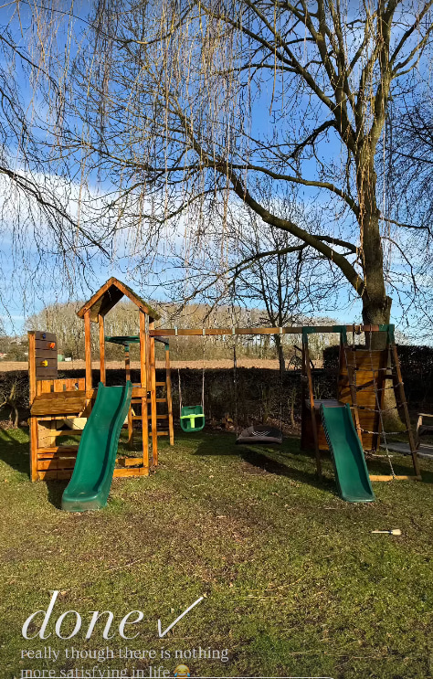 Shot of climbing area in Stacey's garden with field and trees in the background