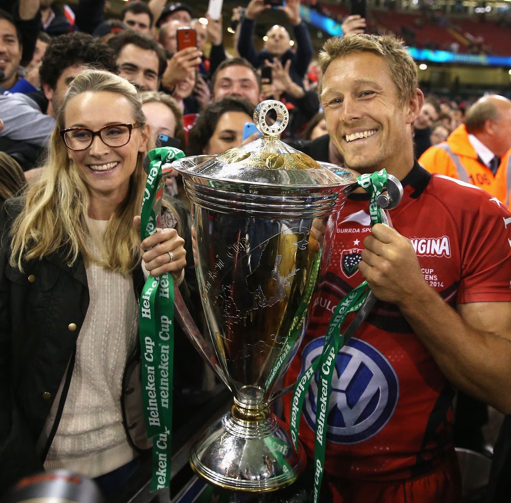 Shelley Jenkins next to Jonny Wilkinson holding a trophy