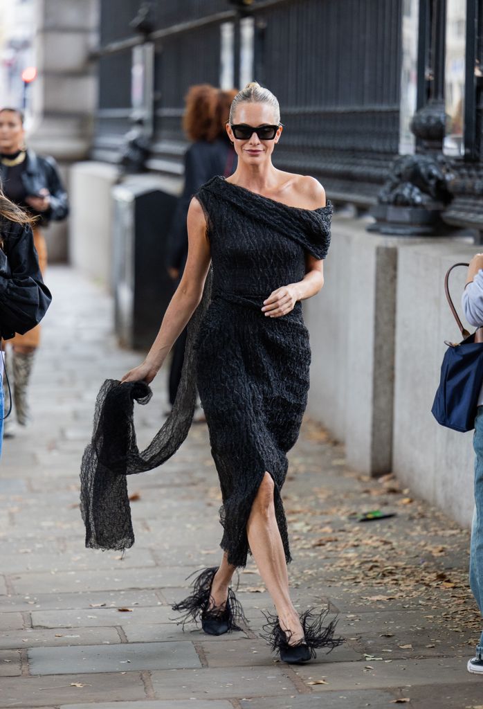 Poppy Delevingne wears black asymmetric dress outside Erdem during London Fashion Week September 2024 on September 15, 2024 in London, England