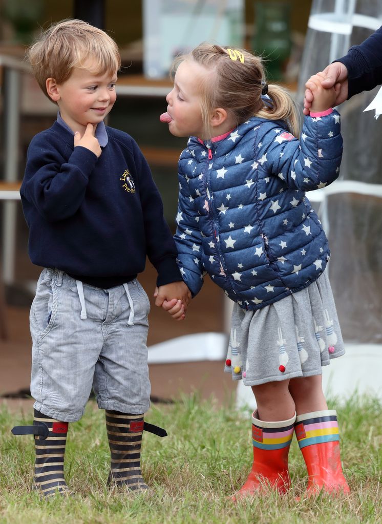 Mia Tindall sticks her tongue out at friend