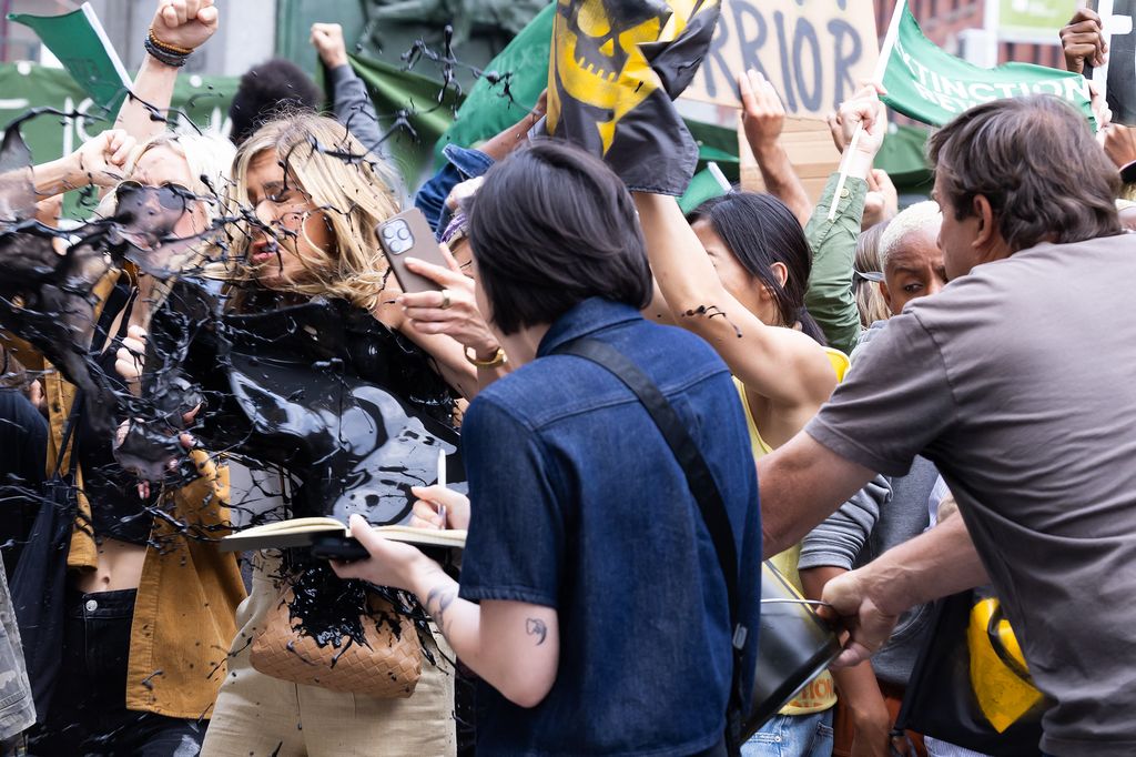 Jennifer Aniston gets oil thrown at her during a scene for The Morning Show