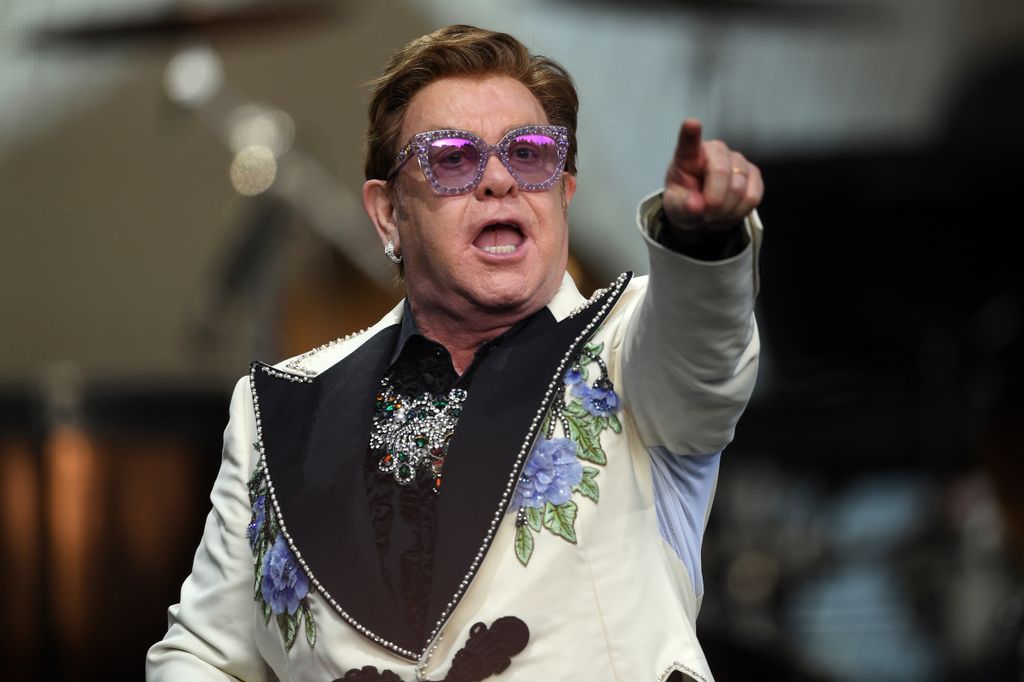 Elton John performing on stage