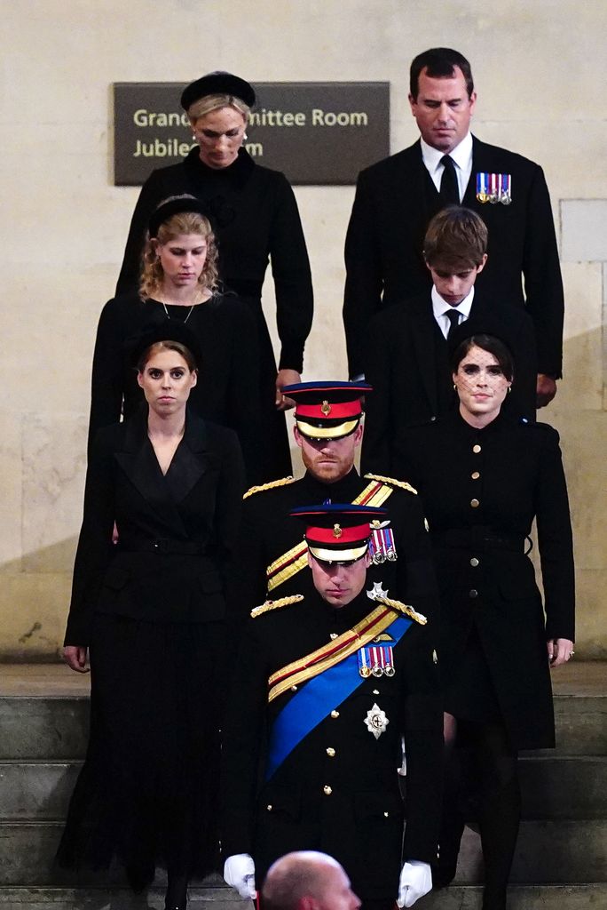Grandchildren of Queen Elizabeth II, bottom to top,  Britain's Prince William , Prince of Wales leads his brother Britain's Prince Harry, Duke of Sussex, followed by their cousins Britain's Princess Beatrice of York and Britain's Princess Eugenie of York, Britain's Lady Louise Windsor and Britain's James, Viscount Severn, and Zara Tindall and Peter Phillips arrive to hold a vigil around her coffin in Westminster Hall, at the Palace of Westminster in London on September 17, 2022, ahead of her funeral on Monday. Queen Elizabeth II will lie in state in Westminster Hall inside the Palace of Westminster, until 0530 GMT on September 19, a few hours before her funeral, with huge queues expected to file past her coffin to pay their respects.